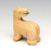 Browsing Giraffe With Turquoise Leaf